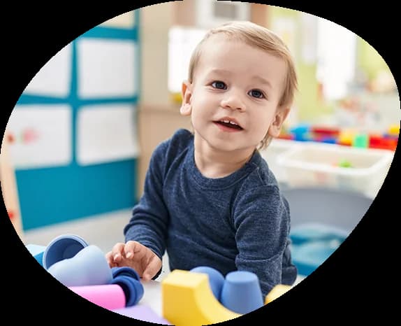 Toddler exploring colorful materials