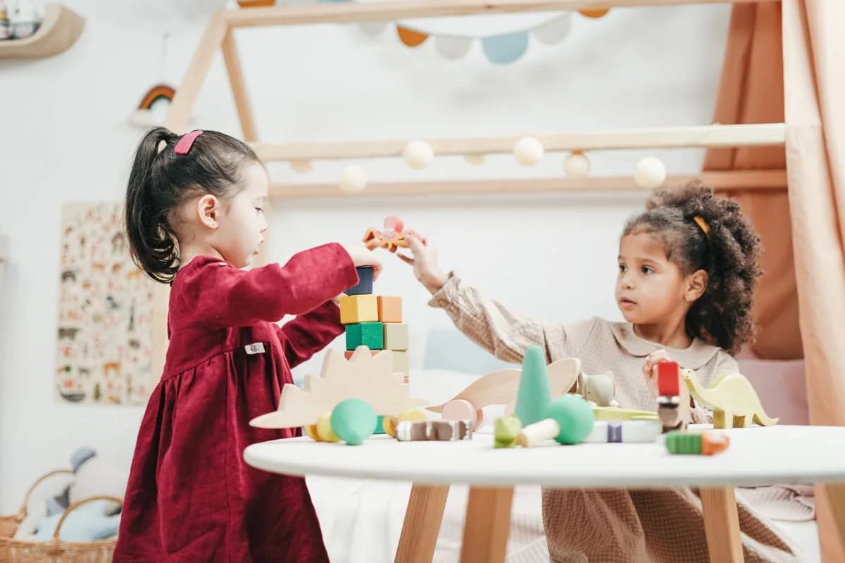 Toddler exploring wooden materials in a calm classroom